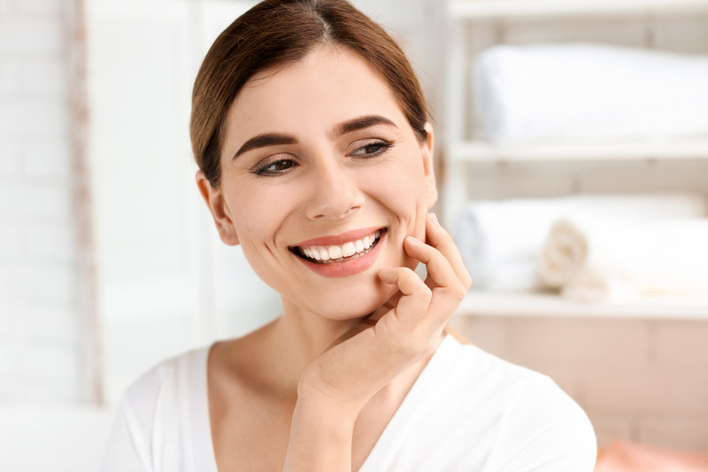 Patient with porcelain veneers smiling